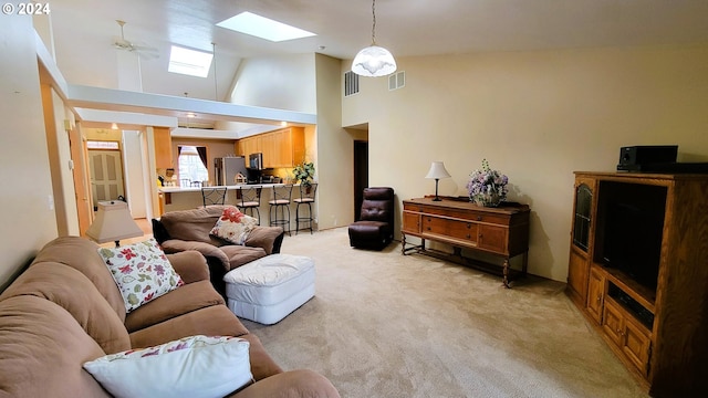 carpeted living room featuring high vaulted ceiling and ceiling fan