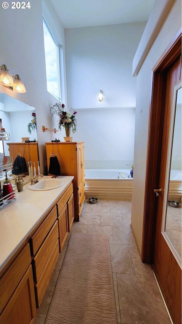 bathroom featuring a bath and vanity