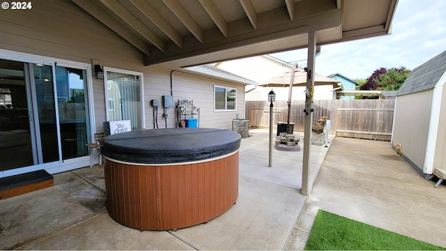 view of patio with a hot tub