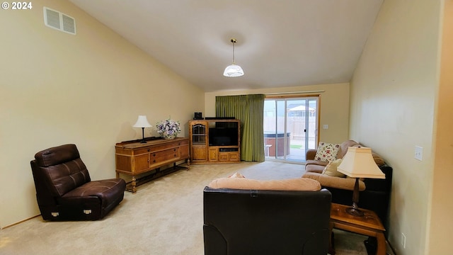 living room with carpet flooring and lofted ceiling