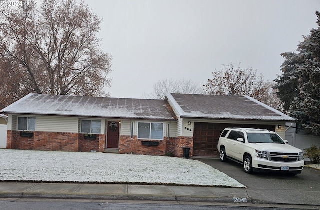 single story home featuring a garage