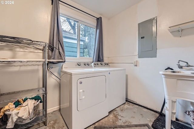 laundry area featuring electric panel and washer and dryer