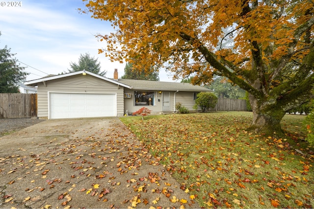 ranch-style house with a front lawn and a garage