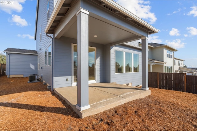 back of house featuring central AC unit and a patio area