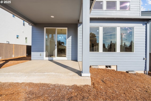 property entrance with a patio