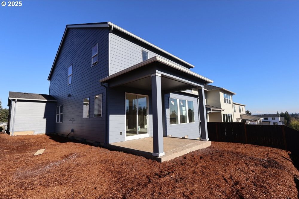 back of property with a patio area