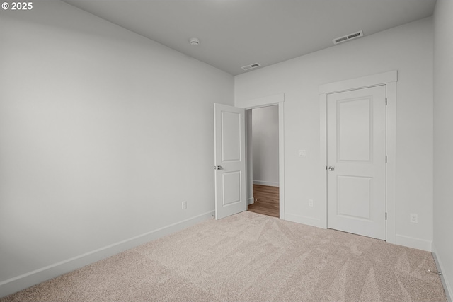 unfurnished bedroom with carpet