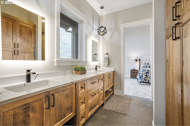 bathroom with tile patterned flooring and vanity