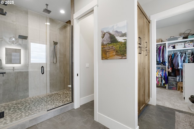 bathroom featuring a shower with shower door