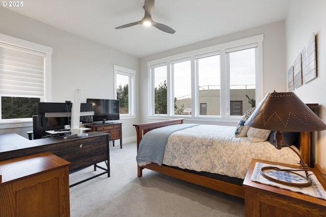 bedroom featuring light colored carpet and ceiling fan