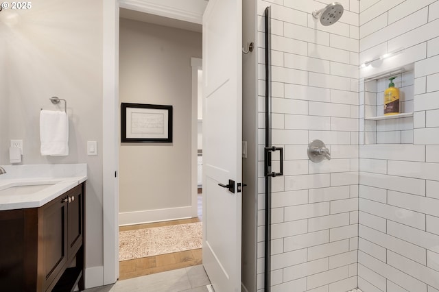 bathroom featuring vanity and an enclosed shower