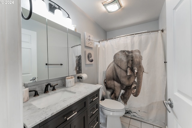 bathroom featuring tile patterned floors, toilet, a shower with shower curtain, and vanity