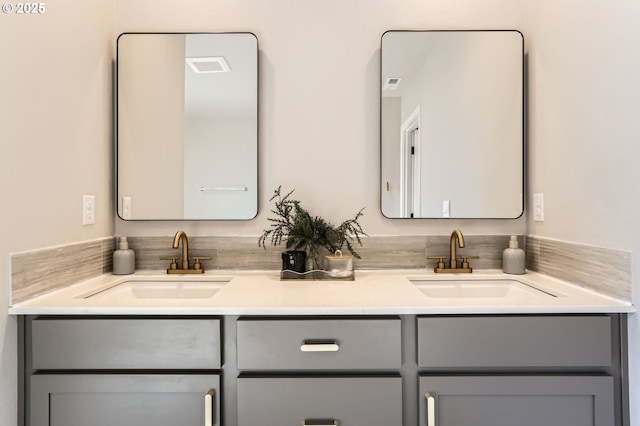 bathroom with a sink and double vanity