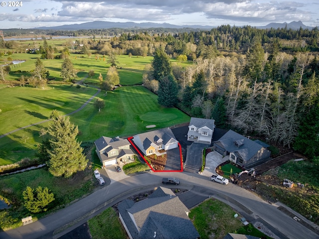 birds eye view of property with a mountain view