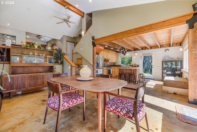 dining space with high vaulted ceiling, wood ceiling, beam ceiling, and ceiling fan