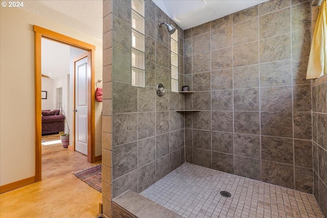 bathroom with a tile shower