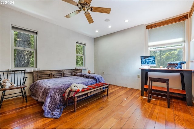 bedroom with wood-type flooring and ceiling fan