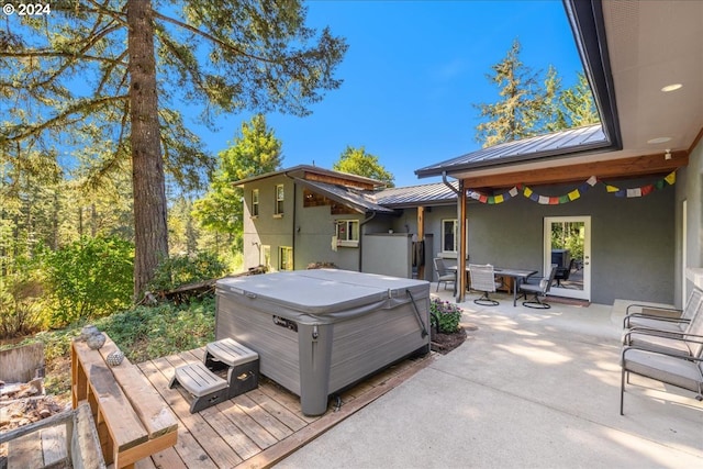 exterior space featuring a hot tub and a patio area