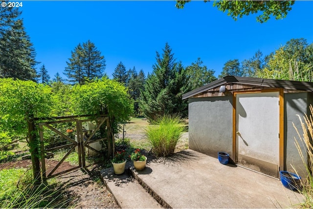 view of patio with an outdoor structure