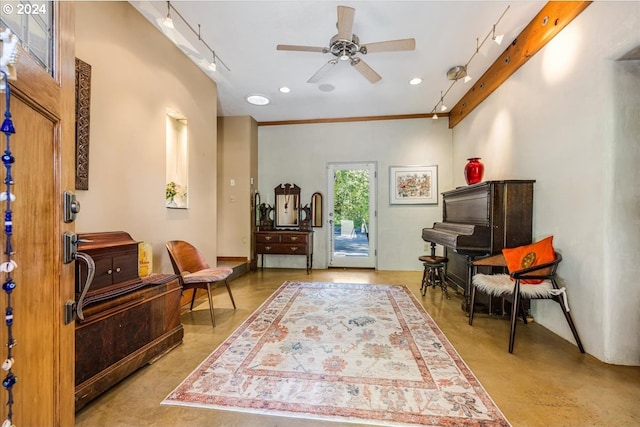 sitting room featuring ornamental molding and ceiling fan