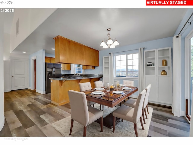 870 Kristen Way, Cottage Grove, OR 97424 - dining area featuring a chandelier, visible vents, recessed lighting, and wood finished floors