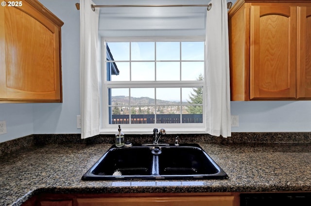 870 Kristen Way, Cottage Grove, OR 97424 - kitchen with a sink, black dishwasher, and brown cabinetry