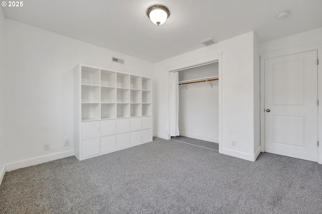 unfurnished bedroom with a closet and carpet