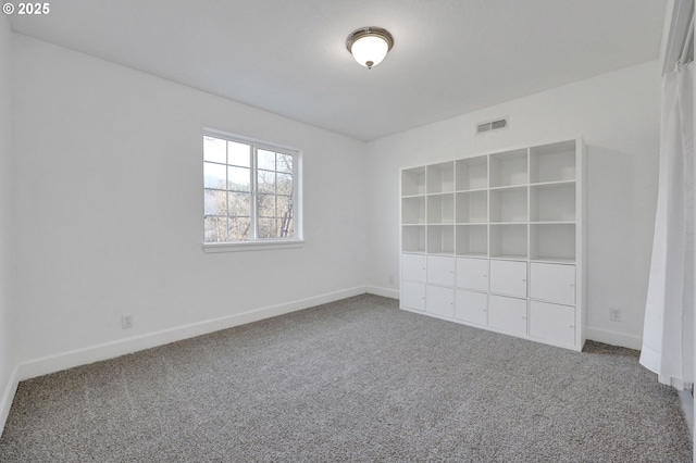 empty room featuring carpet floors