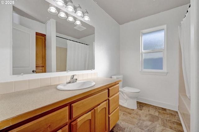 full bathroom with toilet, vanity, and shower / bathtub combination with curtain