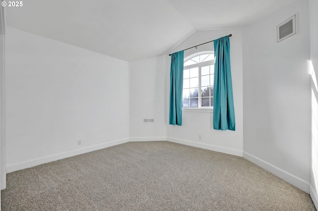 additional living space with vaulted ceiling and carpet floors