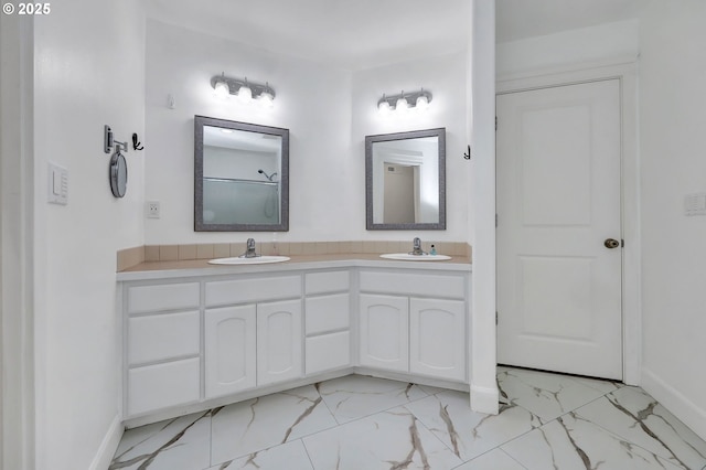 870 Kristen Way, Cottage Grove, OR 97424 - bathroom with double vanity, baseboards, marble finish floor, and a sink