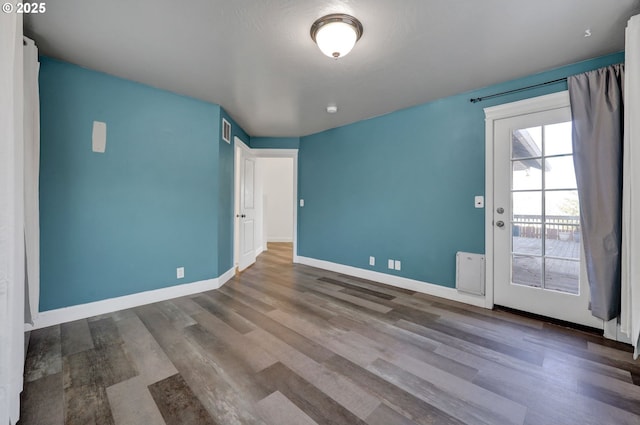 870 Kristen Way, Cottage Grove, OR 97424 - empty room with visible vents, baseboards, and wood finished floors