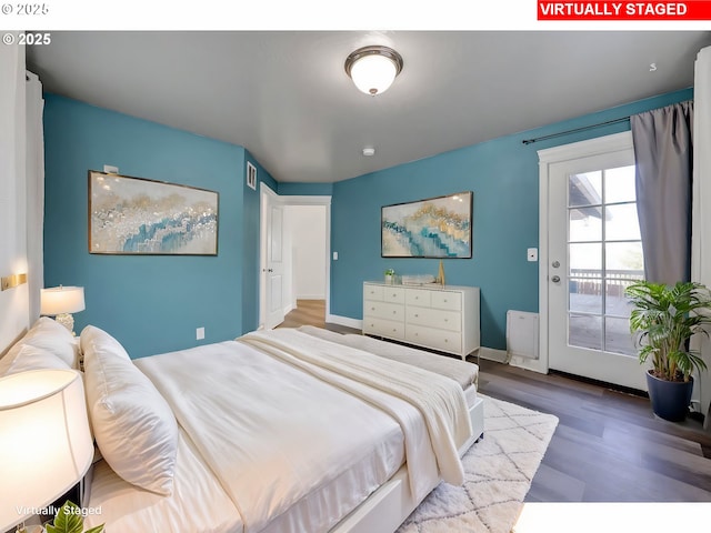 870 Kristen Way, Cottage Grove, OR 97424 - bedroom featuring visible vents, wood finished floors, baseboards, and access to exterior