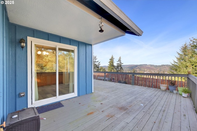 wooden terrace featuring a mountain view