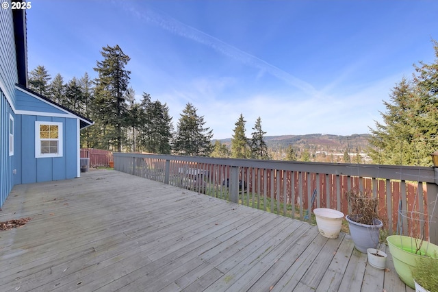 wooden deck featuring a mountain view