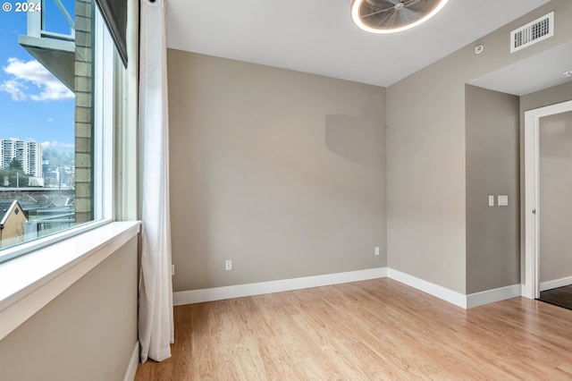 spare room with light hardwood / wood-style floors