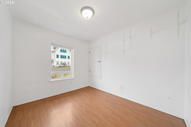 spare room featuring hardwood / wood-style flooring