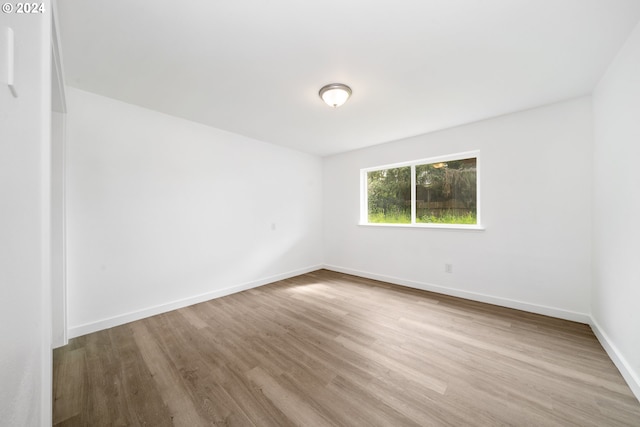 unfurnished room featuring light hardwood / wood-style flooring