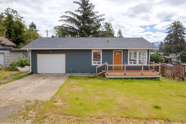 ranch-style house featuring a garage and a front lawn