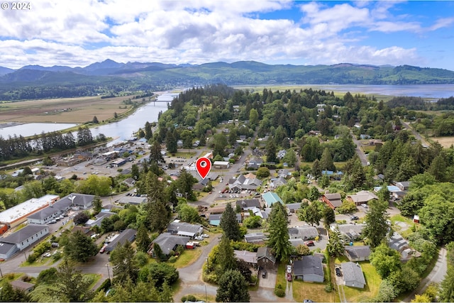 aerial view featuring a water and mountain view