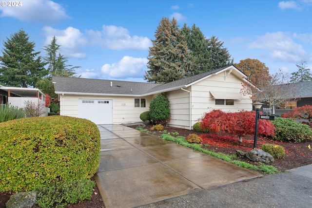 ranch-style home featuring a garage