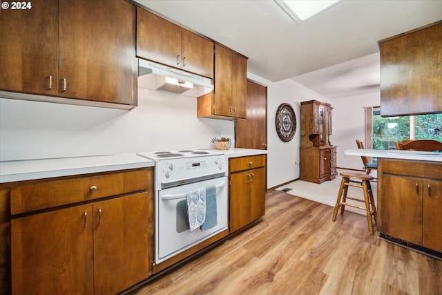 kitchen featuring light hardwood / wood-style flooring and white stove