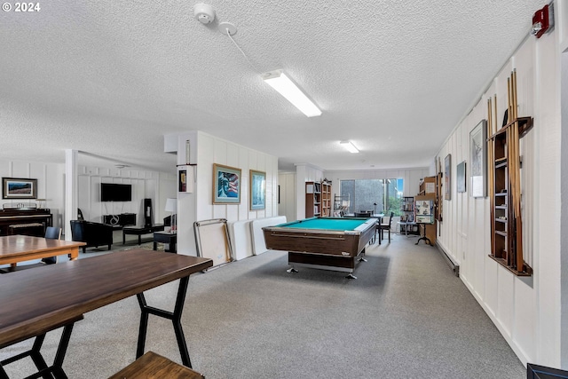 playroom with a textured ceiling and billiards