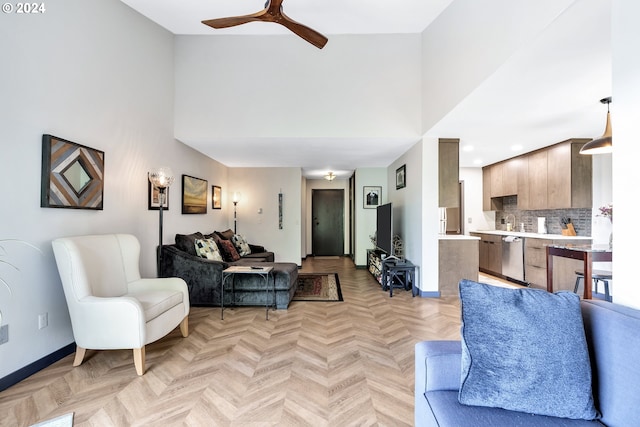 living room with ceiling fan and light parquet floors