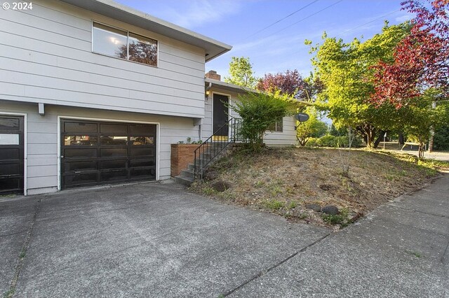 view of side of property with a garage