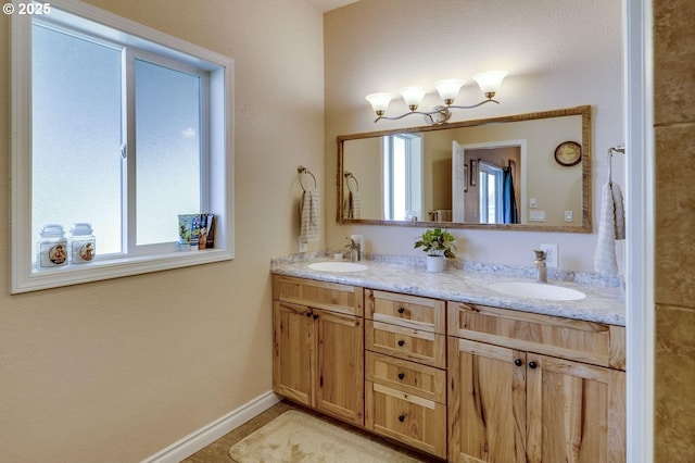 191 SW 67th St, Redmond, OR 97756 - full bath featuring a sink, baseboards, and double vanity
