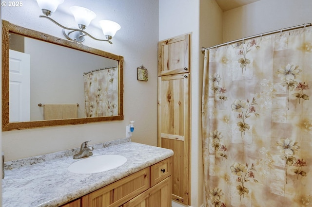 191 SW 67th St, Redmond, OR 97756 - bathroom featuring vanity and an inviting chandelier