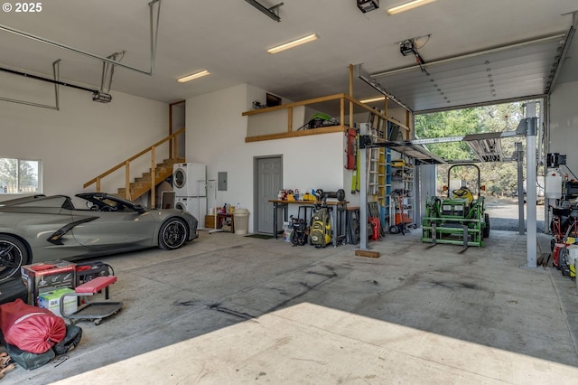 191 SW 67th St, Redmond, OR 97756 - garage featuring stacked washer / dryer and a garage door opener