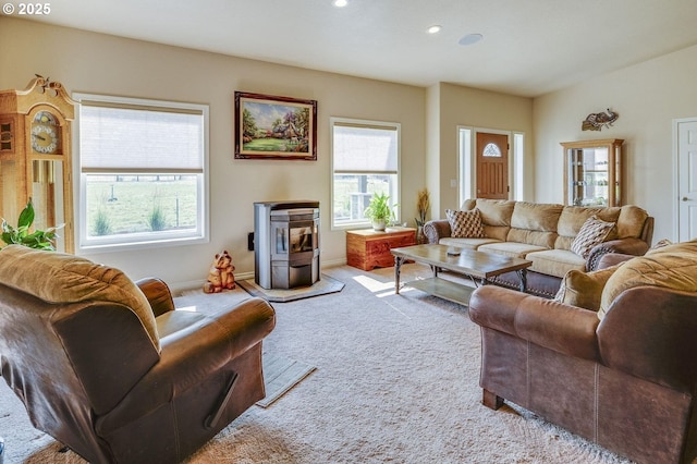191 SW 67th St, Redmond, OR 97756 - living room featuring recessed lighting, a wood stove, carpet, and baseboards