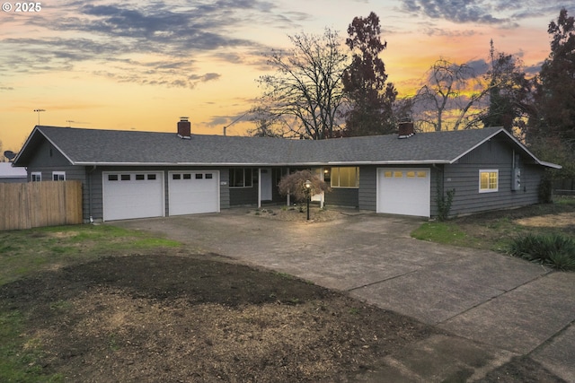 ranch-style house featuring a garage